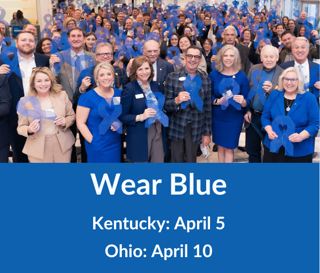 Photo of people dressed in blue holding blue ribbons in support of Child Abuse Prevention Month.